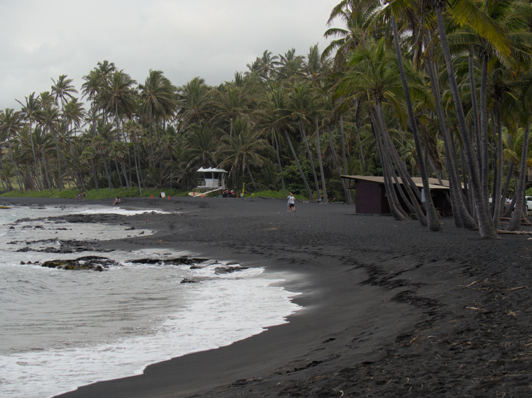 Punaluʻu&rsquo;s black color comes from basaltic rock generated in the near volcanoes.