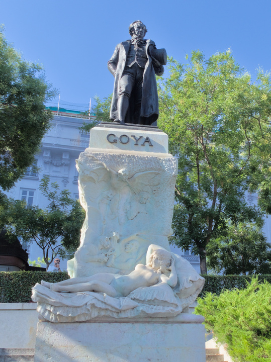 Statue of Goya along some of his paintings, located outside the museum.